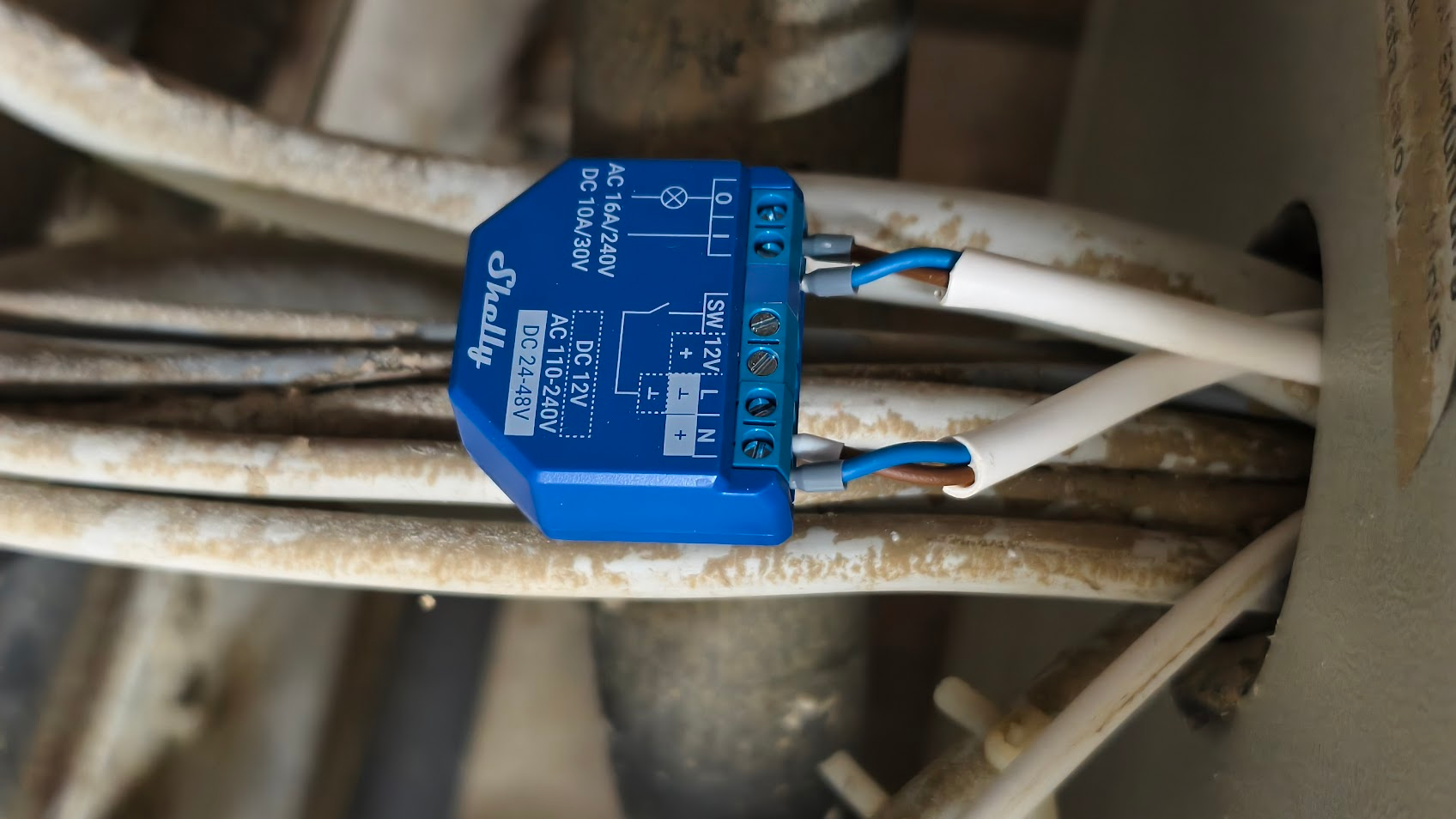 A shelly relay installed at my heatpump